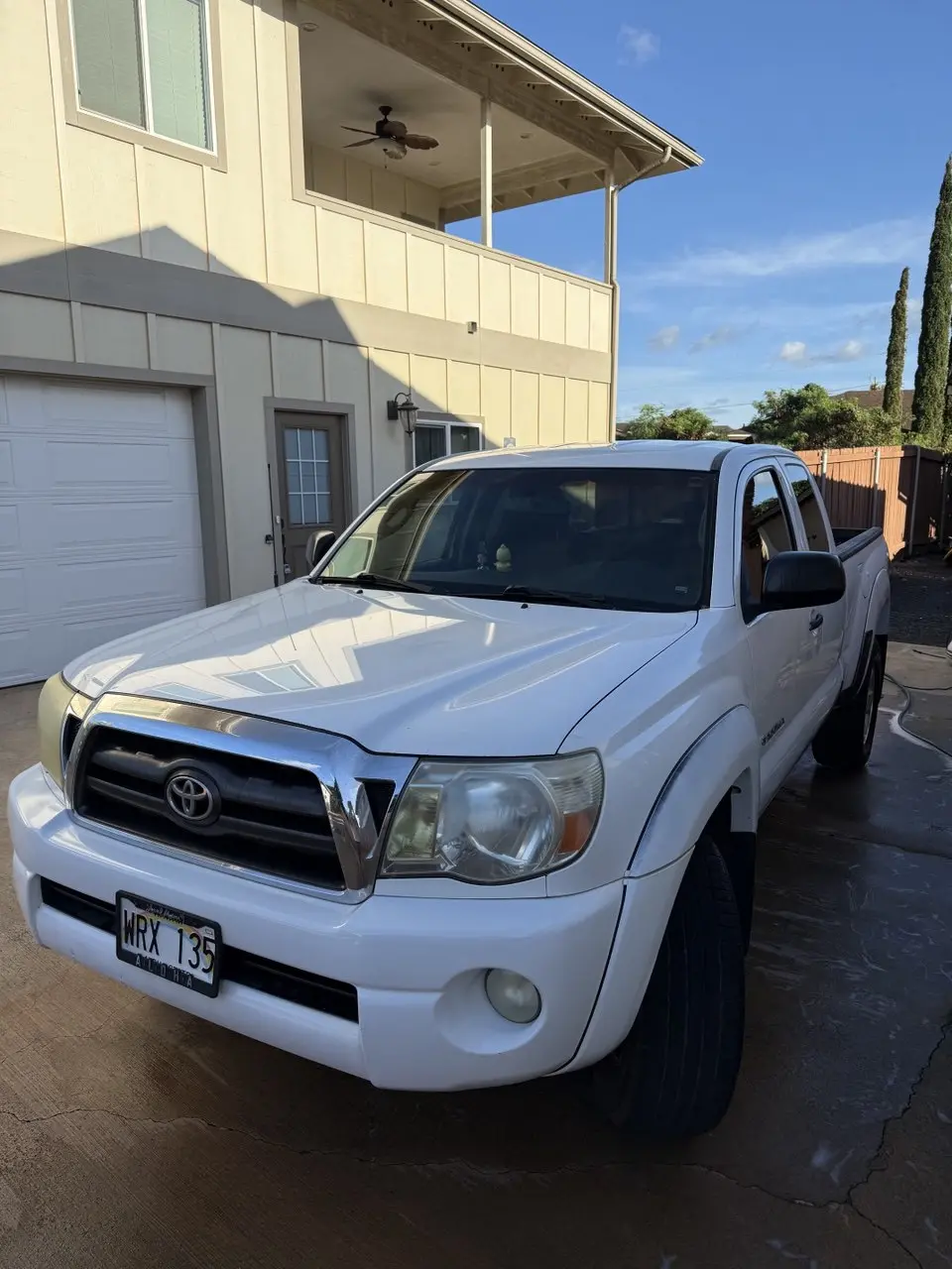 Oxidized yellowed headlights on a Toyota Tacoma before restoration by Mantra